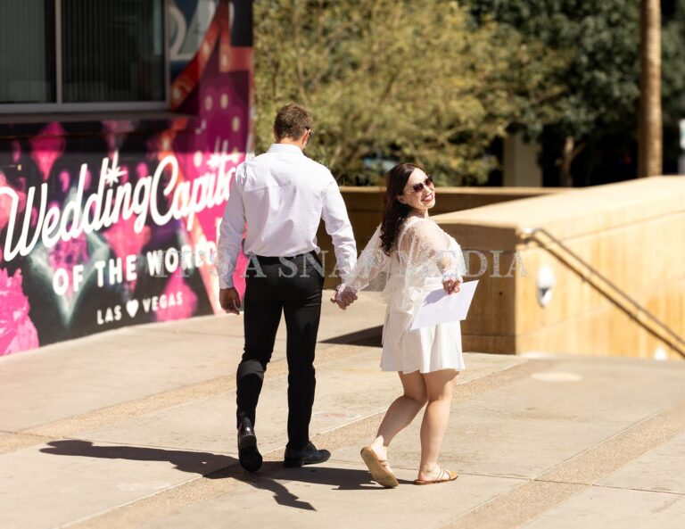 Man and woman smiling after getting marriage license in las vegas