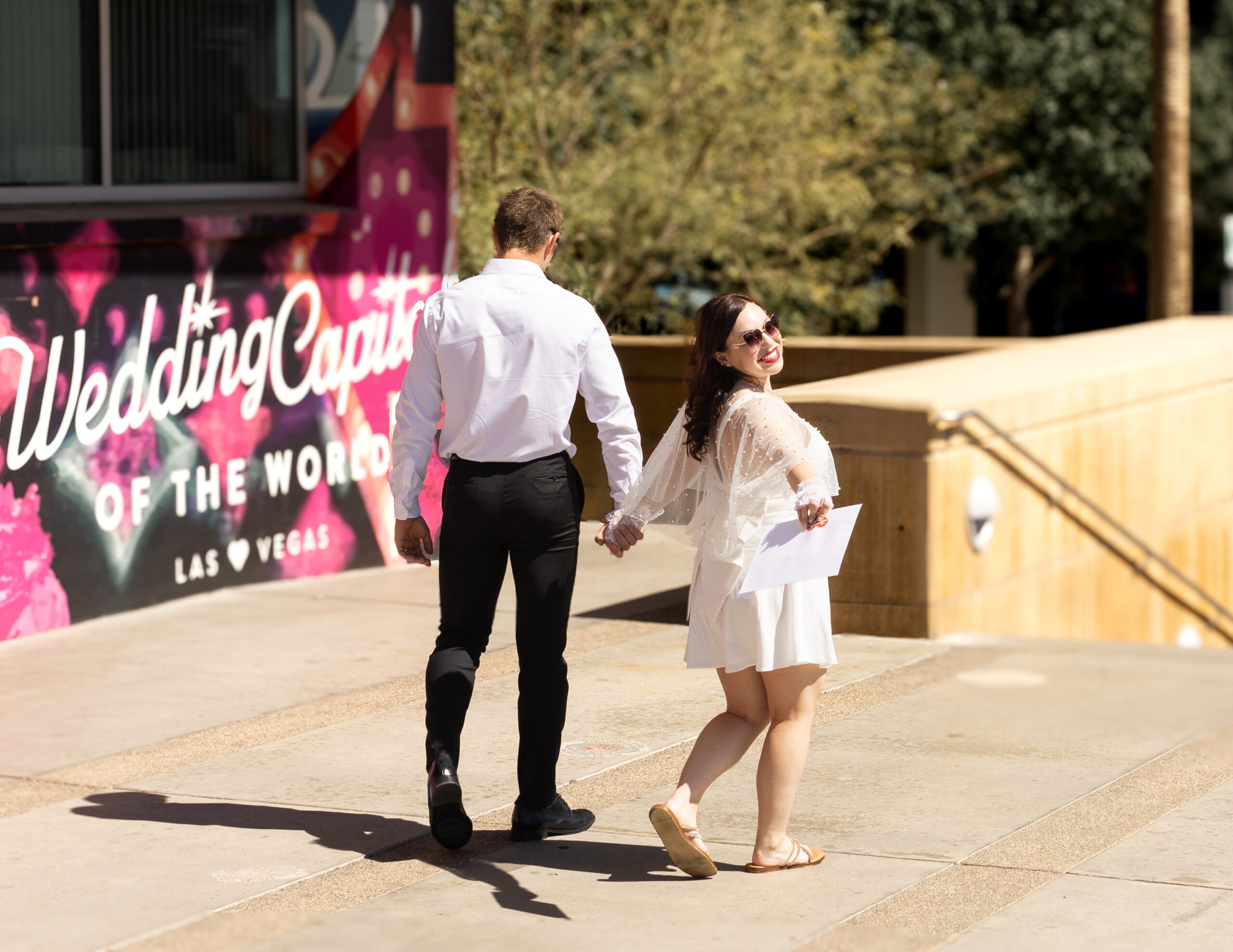 Man and woman smiling after getting marriage license in las vegas