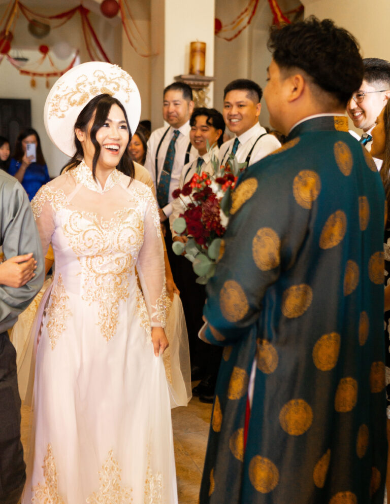 Bride in cream and gold áo dài