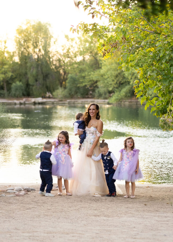 Mother and her young children near a body of water