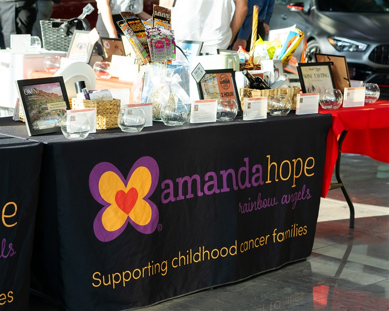 Black Amanda Hope tablecloth banner with gifts on top