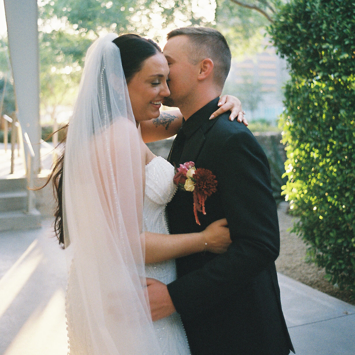 film wedding photo of a bride and groom embracing during their arizona wedding