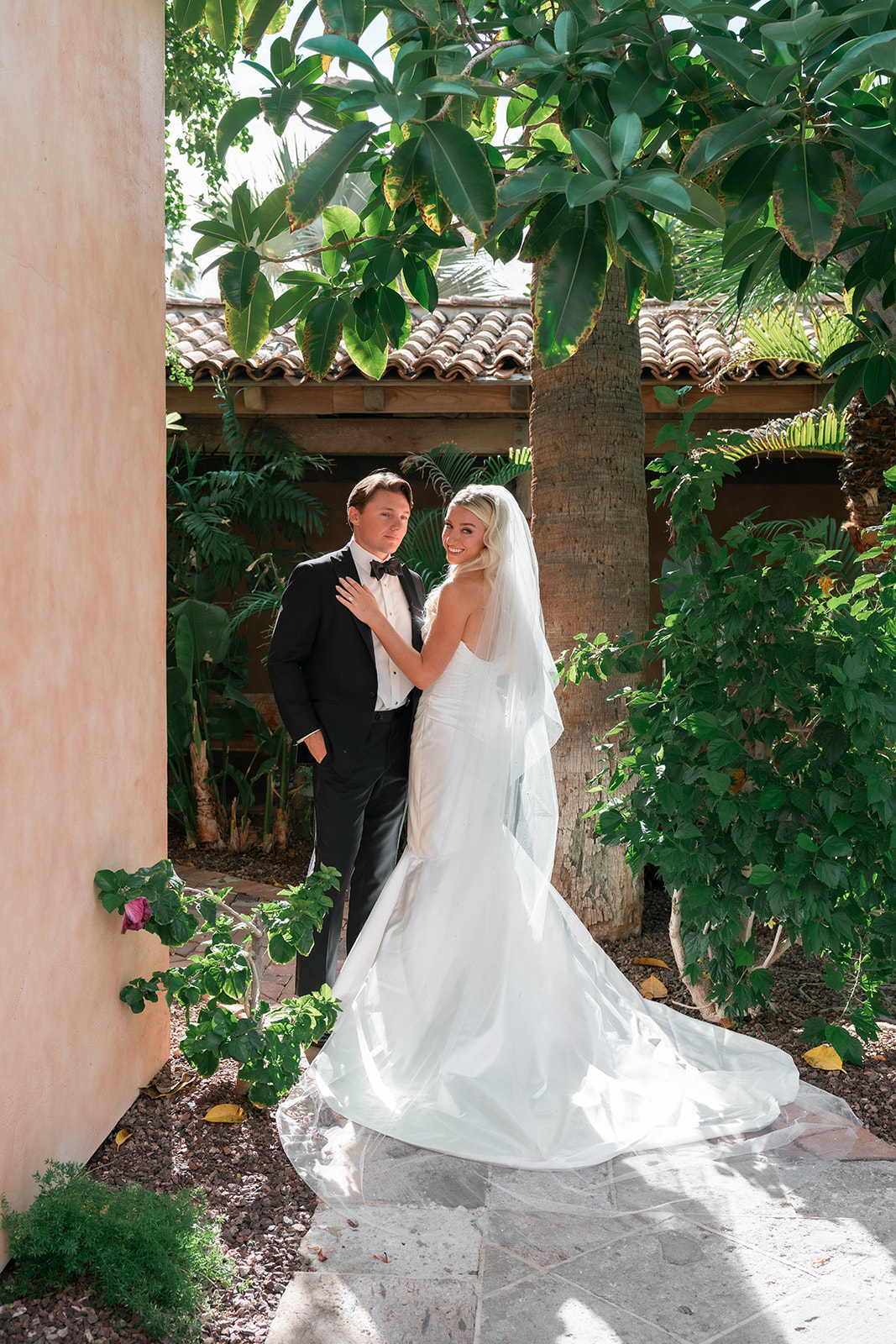 couple smiling during wedding portrait at royal palms resort